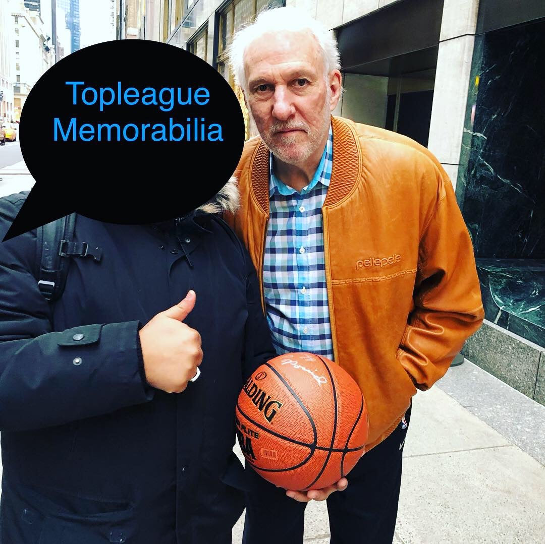Obtaining  Greg Popovich signature on a basketball in NYC.